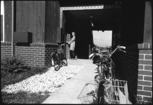 Girl and bicycles at Bay Apartment