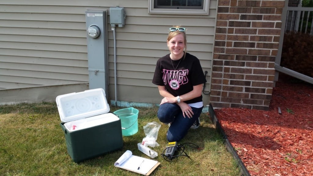 Amanda Hamby collecting water samples from a home in northeastern Wisconsin.