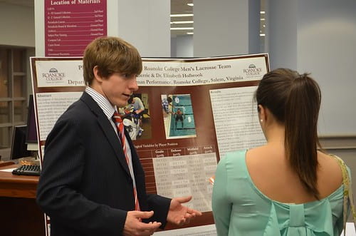 Students presenting at a poster session