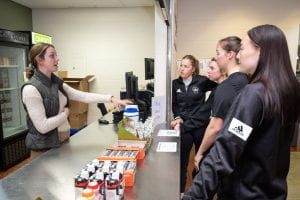 Student receive food from UW-Green Bay Fueling Station