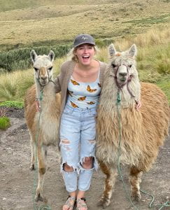 Kendra with llamas in Ecuador